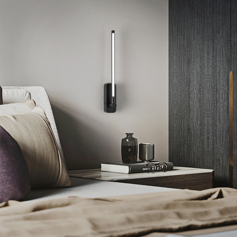 Rechargeable LED wall light beside a bed